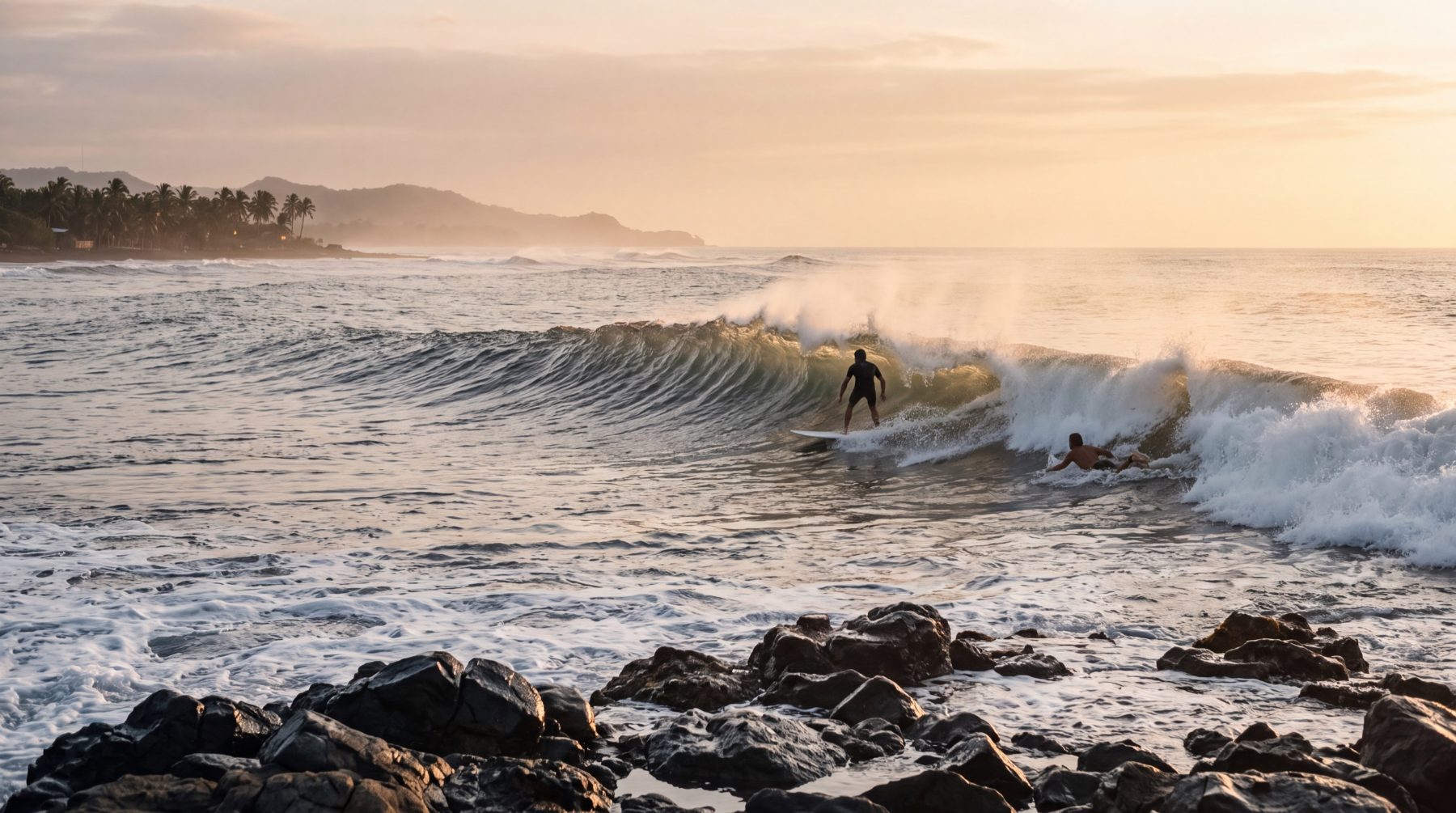 Surfers on the point at Punta Roca